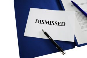 dismissed / dismissal sign with application portfolio background - job, economy, business &amp; career